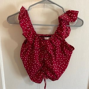 Red tank top with white polka dots.